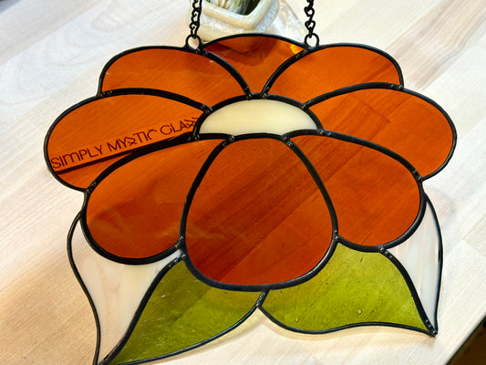 Burnt orange stained glass flower